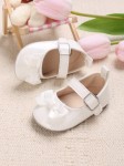 Baby-Lackschuhe, weiße Schleife, Eleganz, Komfort, Sicherheit, hochwertige Materialien, zart lackiert, einzigartiges Design, natürliche Entwicklung, gesundes Wachstum, besondere Erinnerungen