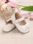 Baby-Lackschuhe, weiße Schleife, Eleganz, Komfort, Sicherheit, hochwertige Materialien, zart lackiert, einzigartiges Design, natürliche Entwicklung, gesundes Wachstum, besondere Erinnerungen