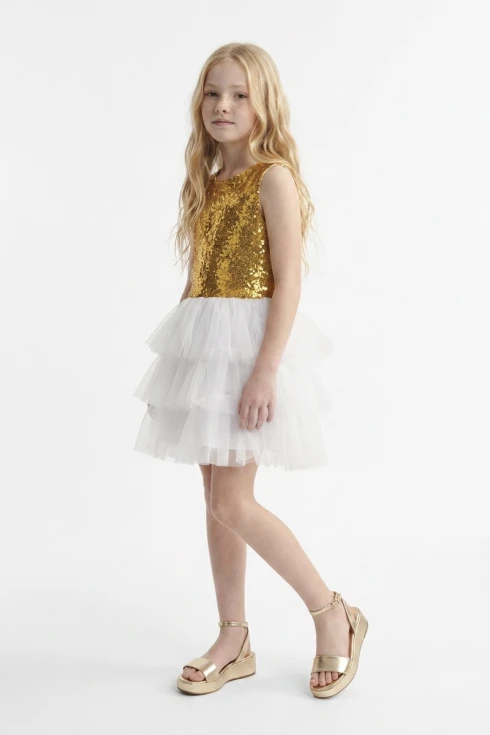 Paillettenkleid Riva in Weiß-Gold für Mädchen – goldenes Paillettenoberteil und weißer Tüllrock – Ganzkörperansicht von vorn