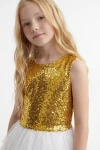 Paillettenkleid Riva in Weiß-Gold – goldenes Paillettenoberteil mit rundem Ausschnitt – Detailaufnahme bis zur Taille